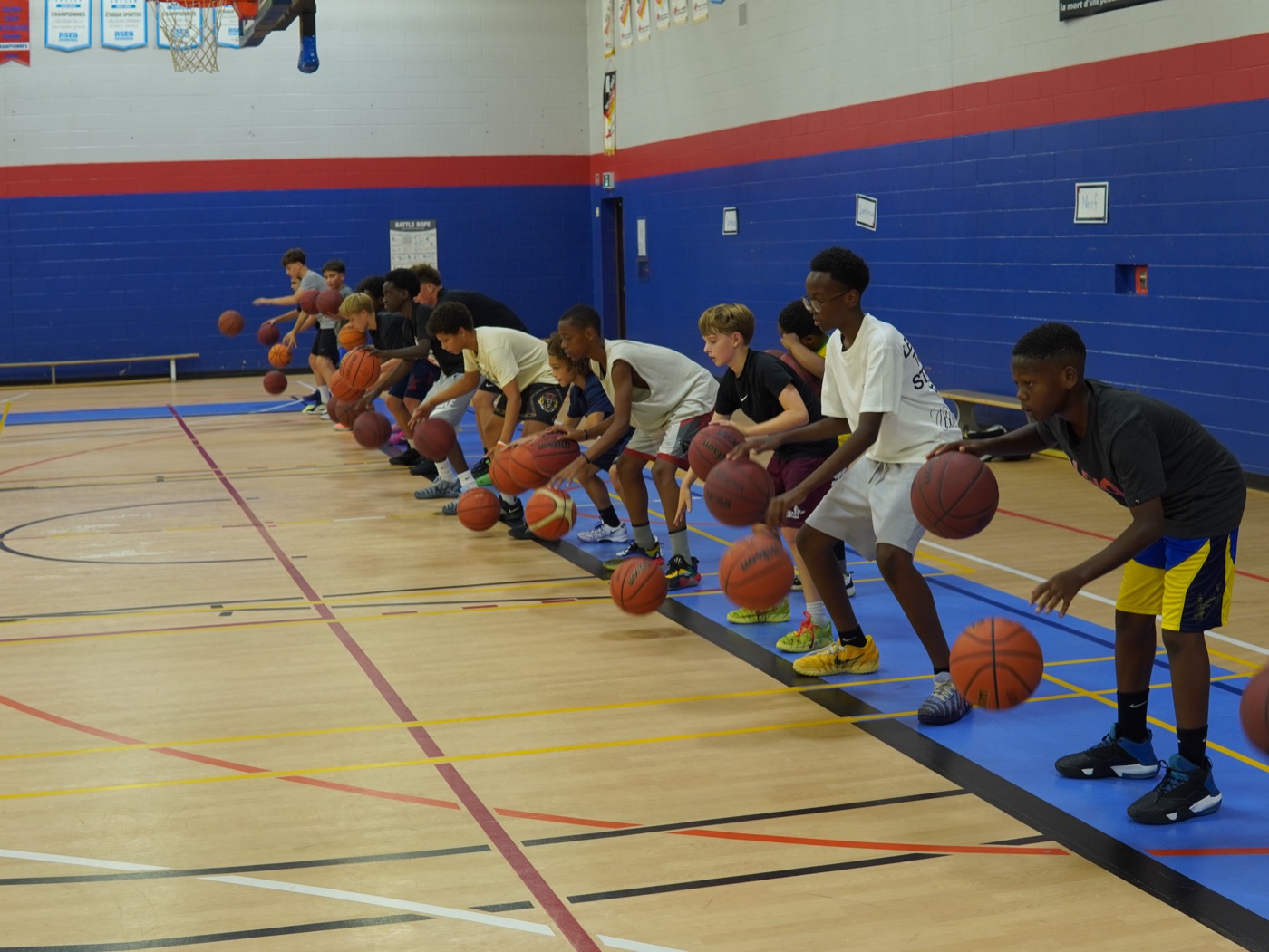 Check Up Basketball players working through a dribbling drill together