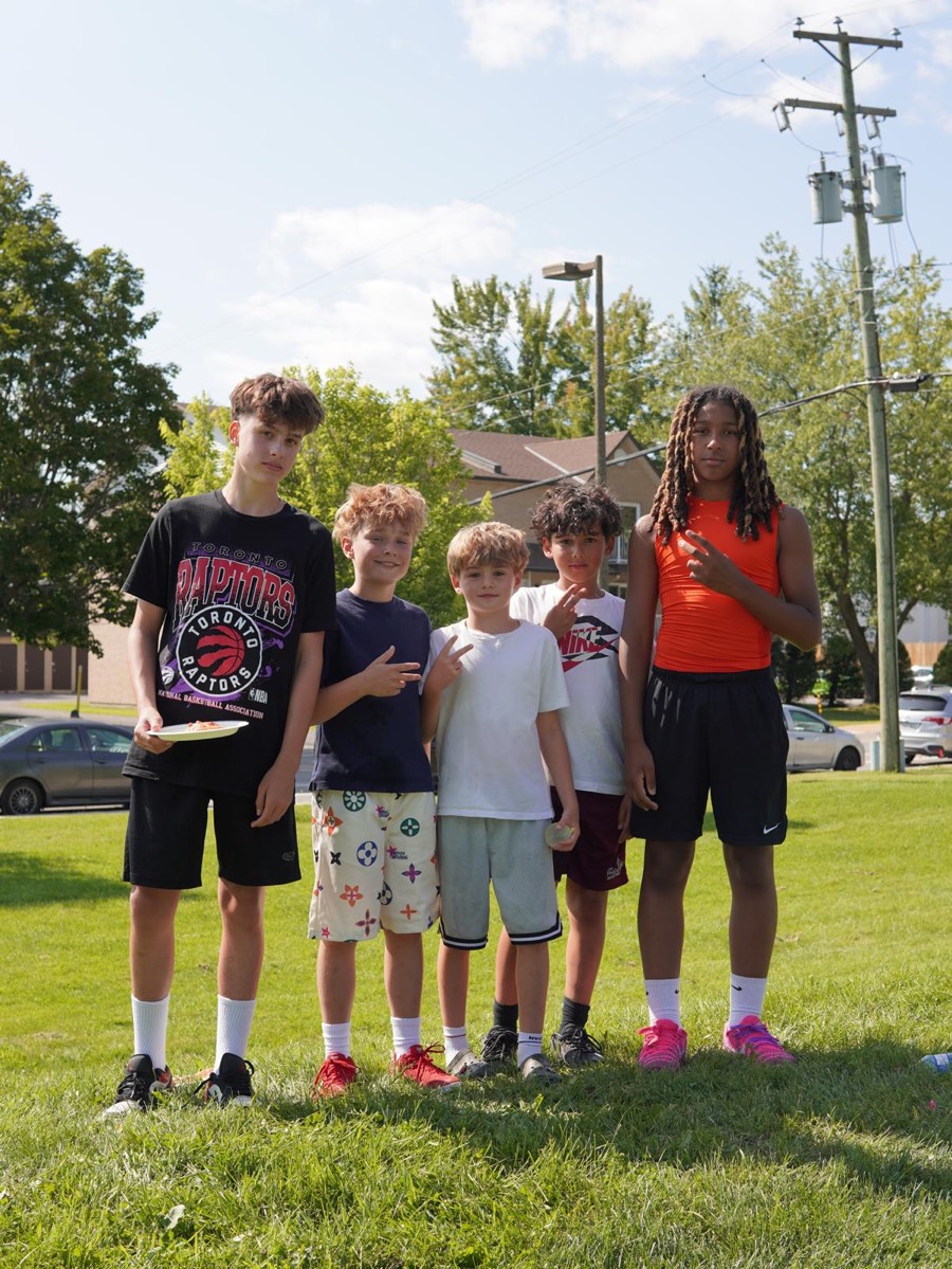 Young players posing together at a Check Up community event