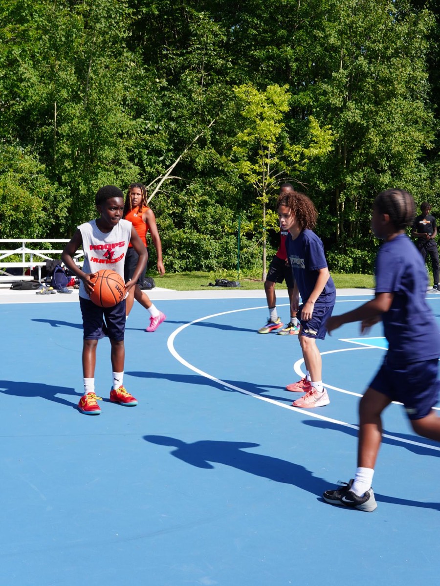 Players on the court during a game at a Check Up community event